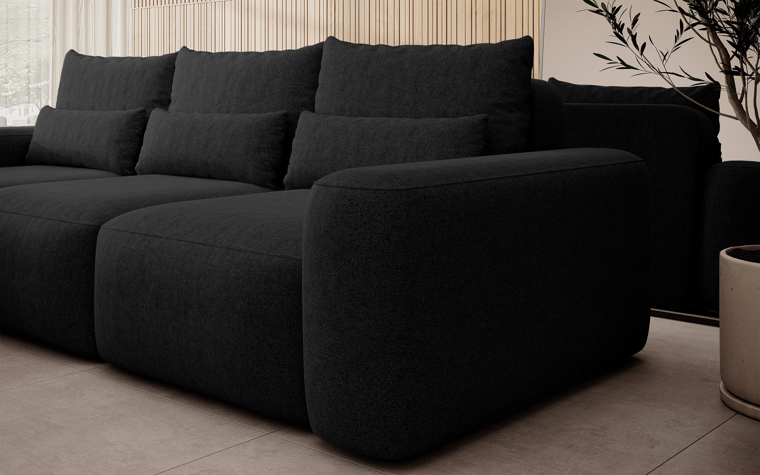Ecksofa mit Schlafunktion Carnos, L-förmig, mit zusätzlichen Lendenkissen, schwarzer hydrophober Chenille, linksseitig