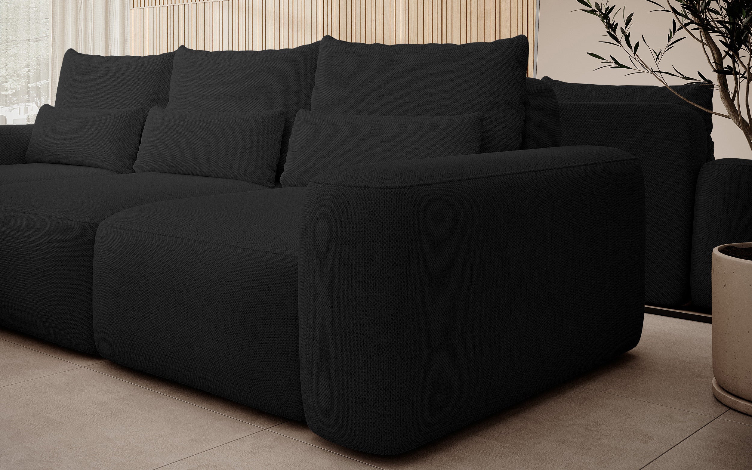 Ecksofa mit Schlafunktion Carnos, L-förmig, mit zusätzlichen Lendenkissen, schwarzer hydrophober Chenille, linksseitig