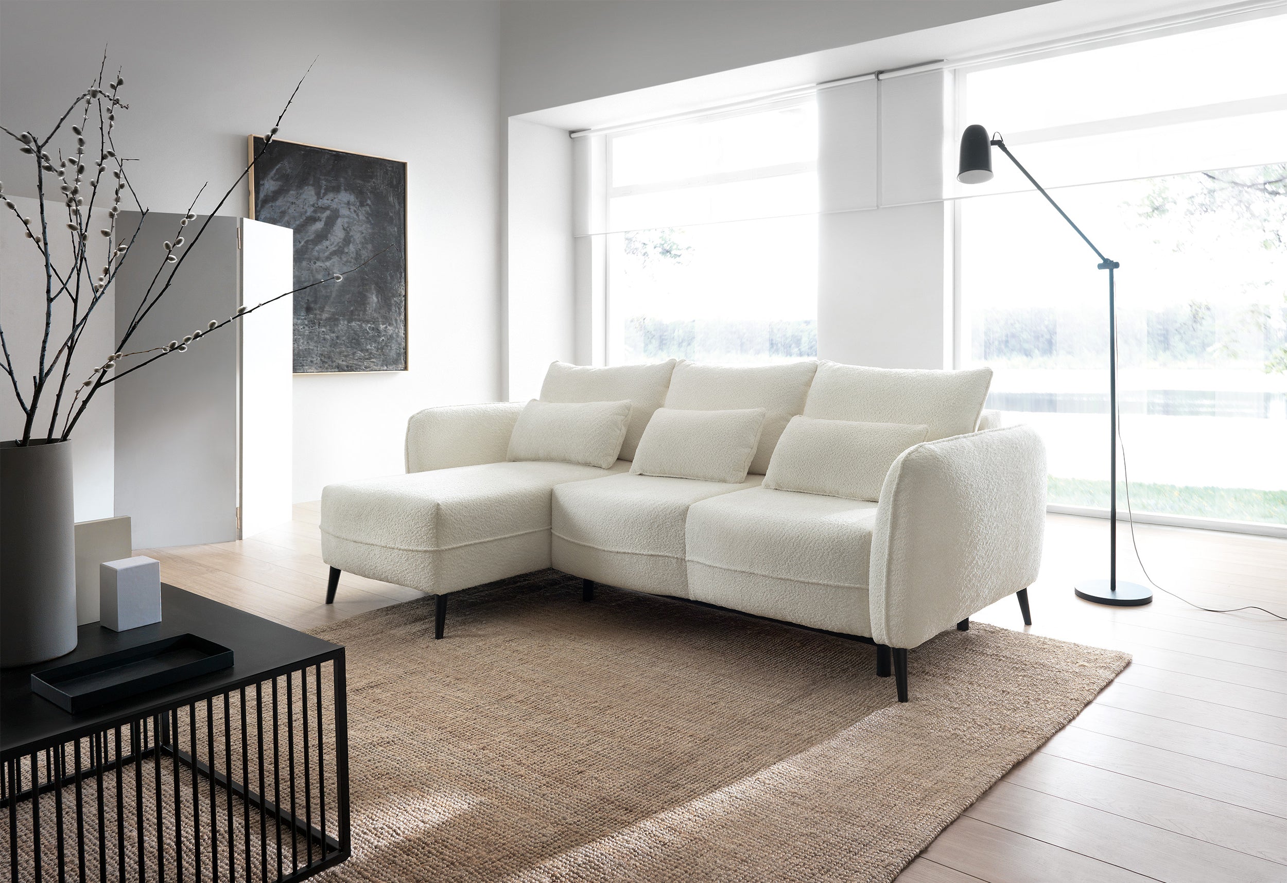 Ecksofa mit Schlaffunktion Eliano, L-förmig, mit Stauraum, cremefarbenes Bouclé, linksseitig