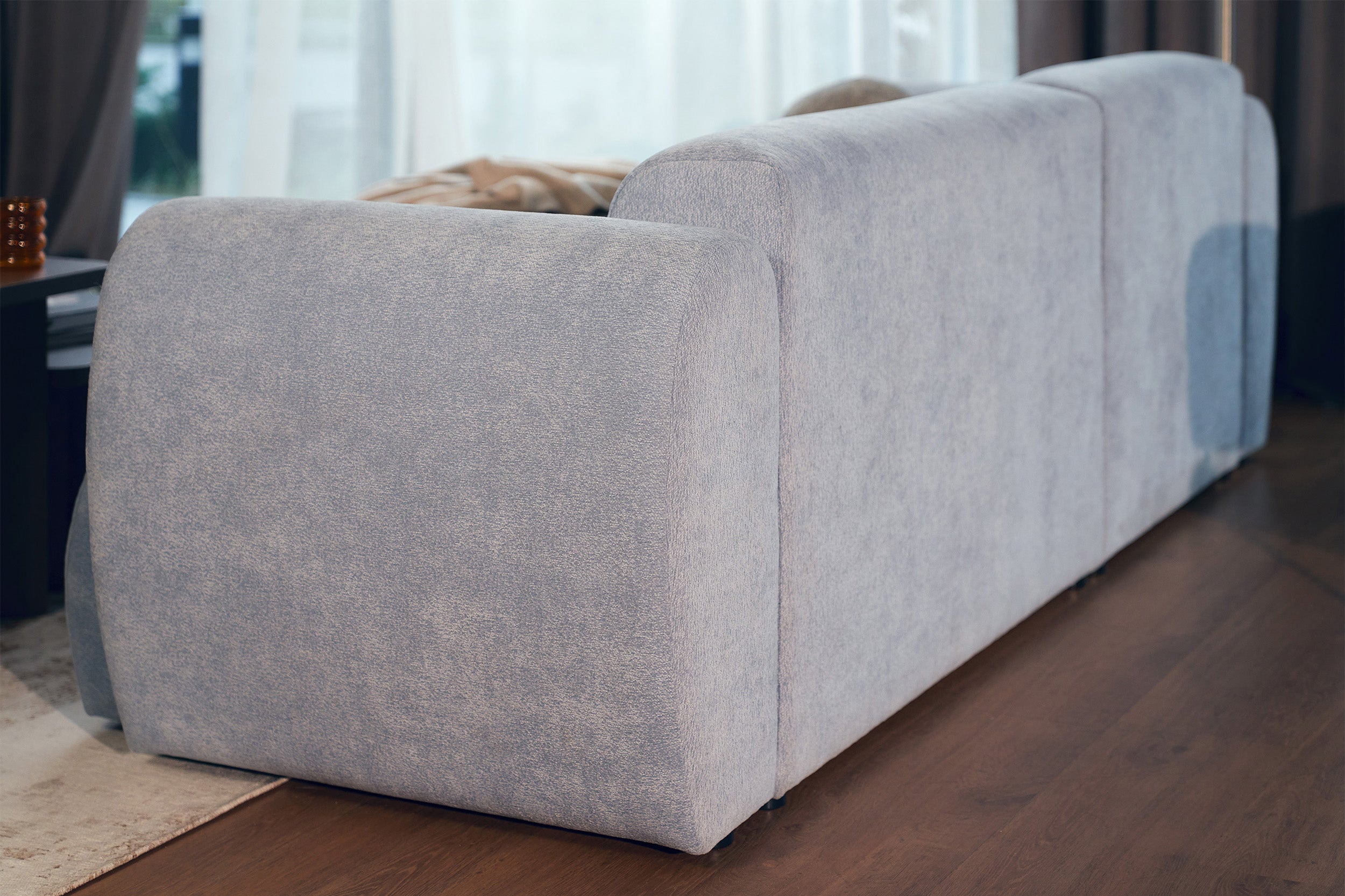 Ecksofa mit Schlaffunktion Emia, L-förmig, linksseitig, hellblauer Chenille-Bezug