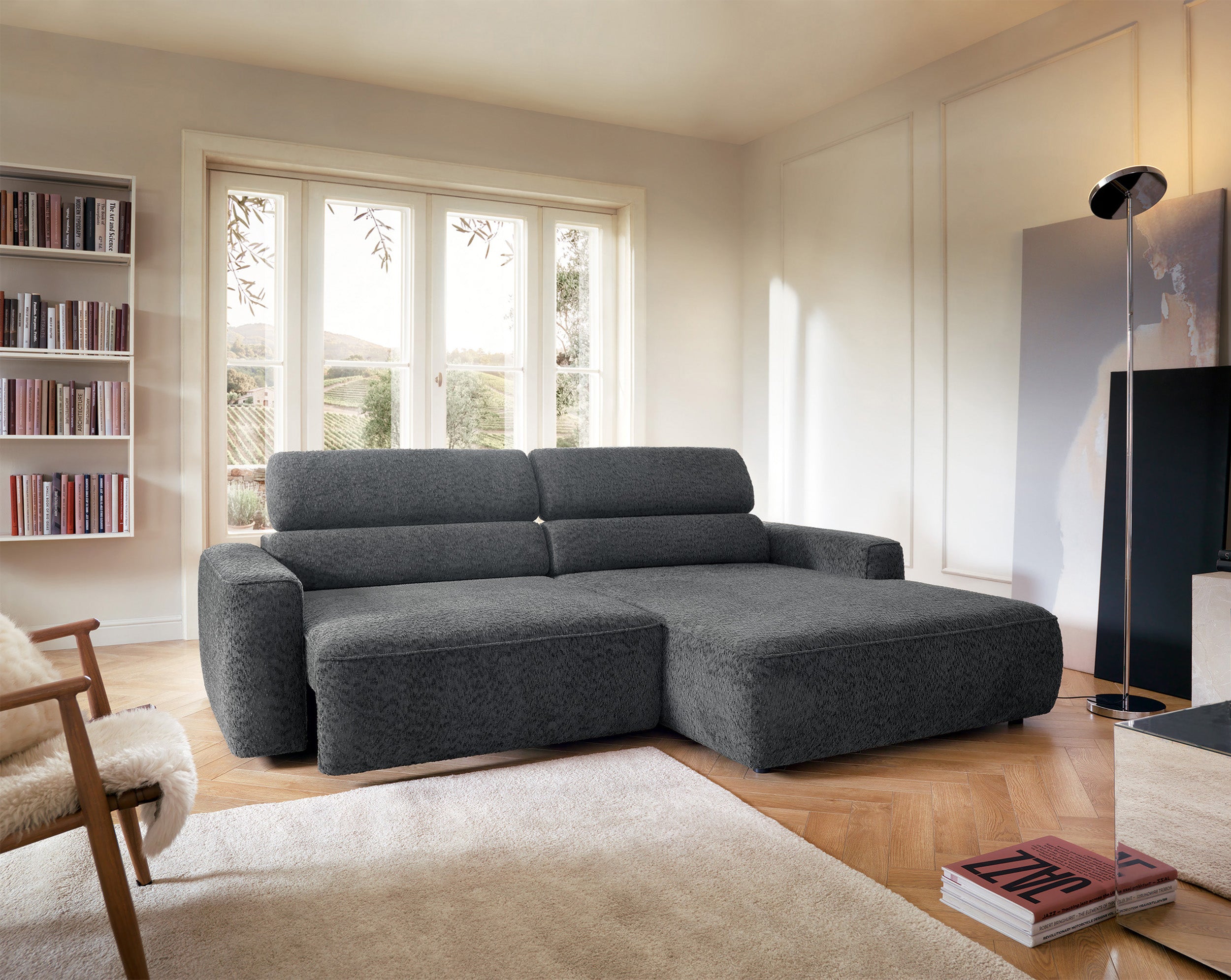 Ecksofa Fando mit elektrisch ausziehbarer Sitzfläche, L-förmig, rechtsseitig, dunkelgrauer Chenille-Stoff